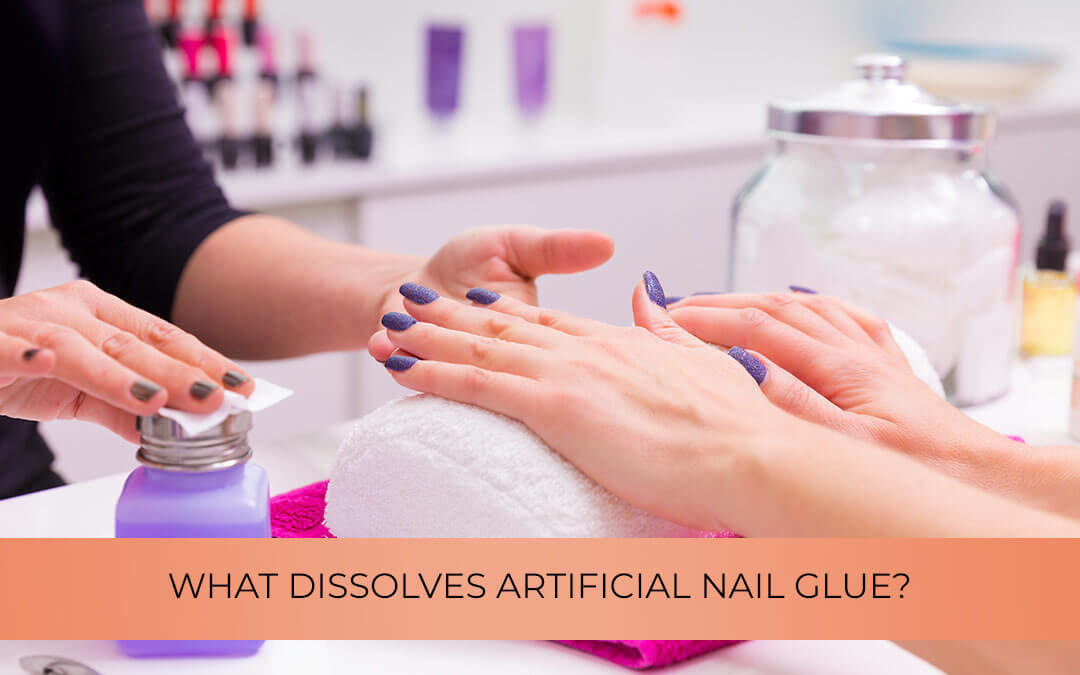 What dissolves artificial nail glue?